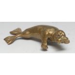 An early 20th century brass desk model, of a walrus, 15cm long