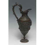 A 19th century brown patinated bronze ovoid ewer, cast with satyr mask, ribbon-tied garlands,