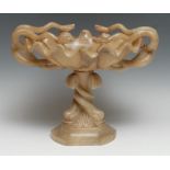 A 19th century alabaster tazza, the oval bowl with wavy rim entwined with snakes, the canted triform