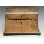 A Victorian walnut domed concave tea caddy, hinged cover enclosing a pair of lidded compartments,