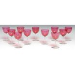 A set of cranberry glass wine glasses, hemi-ovoid bowls, 12cm high (11)