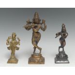 An Indian bronze murti, Krishna, playing a bansuri, 20.5cm high, 19th/early 20th century; others (3)