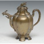 A Chinese bronze wine pot, cast as a peach, mask to spout, branch handle, 20cm high, early 20th