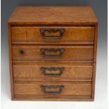 An early 20th century oak table top chest, flush top above for filing or collector's drawers,
