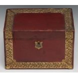 An Edwardian brass mounted red morocco desk top stationery box, hinged sloping cover enclosing an
