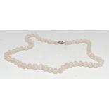 A Chinese quartz necklace, of carved beads, 55cm long