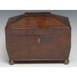 An early Victorian mahogany sarcophagus tea caddy, hinged cover enclosing a pair of of lidded