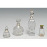 A George V silver mounted cut glass scent bottle, 15cm high, Birmingham 1928; others (4)