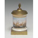 A French Empire porcelain and brass desk inkwell, painted with a maritime scene, the cover with pine