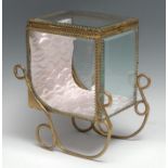 A Continental gilt brass novelty table top bijouterie display cabinet, as a carriage sled, 26.5cm