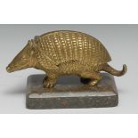 A 19th century bronze novelty animalier encrier, cast as an armadillo, hinged cover enclosing a pair