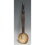 Tribal Art - a horn spoon, the anthropomorphic handle carved with a mask, 30cm long