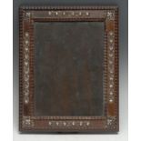 A Dutch Colonial silver mounted hardwood easel photograph frame, applied with bands of stylised