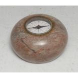 An early 20th century marble combination desk weight and compass, 8.5cm diam