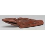 An Egyptian terracotta bathing rasp, as a crocodile, 20cm long