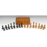 A boxwood and ebony chess set, weighted bases, marked for King's side, the Kings 8.5cm high