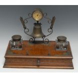 A substantial Victorian E.P.N.S mounted oak desk stand, incorporating a timepiece above a bell,