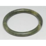 A Chinese jade bangle, 8cm diam