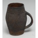 Tribal Art - a Kuba drinking cup, carved overall with geometric motifs, 8.5cm high, Congo