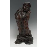 A Chinese rootwood carving, as an elder holding a shoe, 37cm high, 19th century