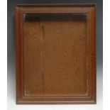 An early 20th century oak picture frame, adapted to form a wall hanging collector's display case,