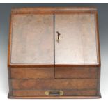 A Victorian burr walnut slope-front desk cabinet, hinged twin covers and concave moulded top