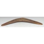 Tribal Art - an Australian Aboriginal boomerang, stone-carved texture overall, 59cm wide, 19th/early