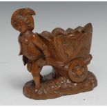 A Black Forest novelty table vesta, carved as a gardner drawing a barrow, 14cm high, c.1900