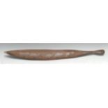 Tribal Art - an Australian Aboriginal woomera spear thrower, carved to verso with stylised emu, on a