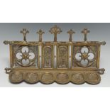 A 19th century Gothic Revival wall mounted six-section smoking room pipe rack, cast with tracery,
