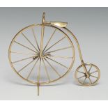 Cycling - a brass desk model, of a penny farthing or ordinary bicycle, 13cm high