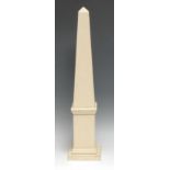 A painted softwood library obelisk, 61cm high