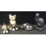 A Winstanley pottery model seated cat; similar kitten; an Artform model cat Tranquility another