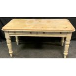 A country house pine dining table, rounded rectangular top, a pair of drawers to each sides,