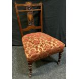 A late Victorian inlaid rosewood nursing chair, turned fore legs, stuffed seat, c.1880