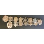 A Chinese silver belt, dragon disc buckle, floral and character panel links, 64cm long, largest