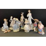 A Lladro figure, Nurse, standing, 5197; Golfer, Girl with Lamb, Mexican Boy and Girl; hound; etc (