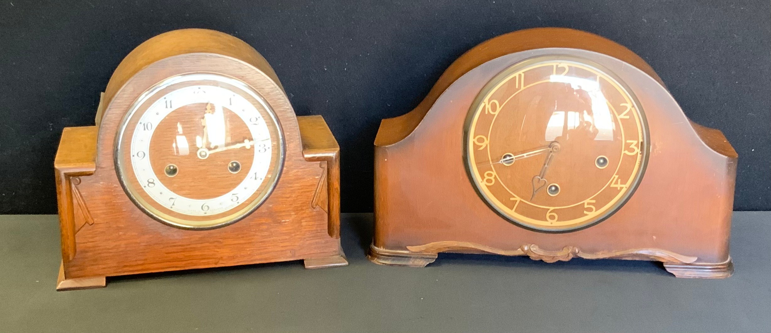 A Smiths oak mantel clock, 23cm high; another bedtime oak mantel clock 22cm high,(2).