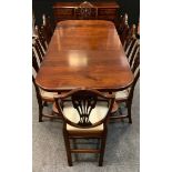 A reproduction twin pedestal extending dining table, rounded rectangular top, canon-barrel