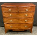 A late Victorian mahogany bow-front chest of drawers, bow-front top above two short and three long
