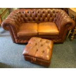 A leather Chesterfield two seat sofa; foot stool ensuite