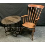 A 20th century oak arm chair, spindle back, saddle seat, turned legs, H-stretcher, 103cm high; a