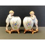 A pair of late 19th century continental KPM style porcelain figural egg vase, painted with
