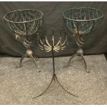 A pair of circular wirework basket planters, spiral vortex column, tripod feet, 64.5cm high, 43cm