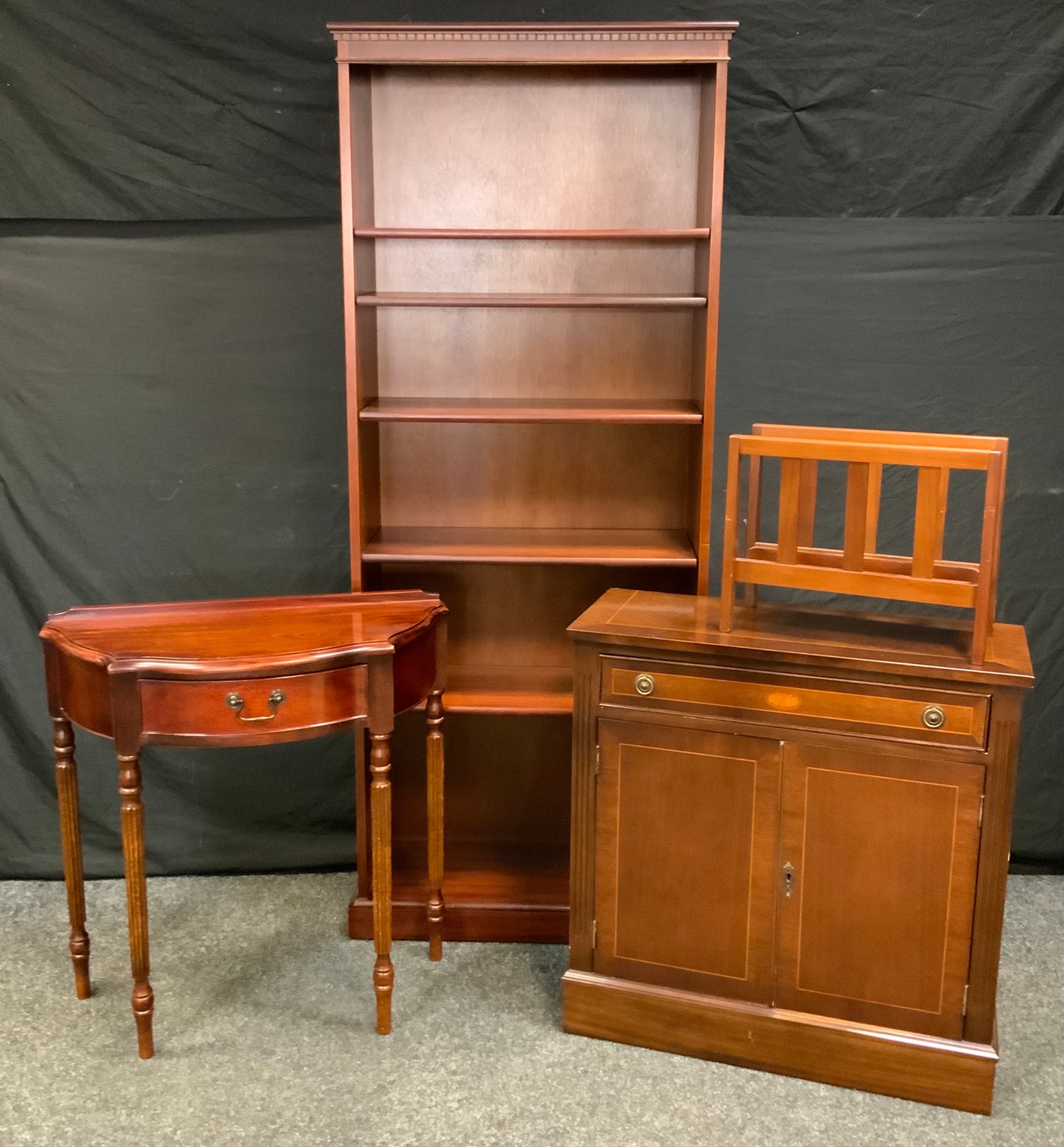 A reproduction mahogany demi-lune side table, half gallery above a single cockbeaded drawer,