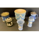 Ceramics - a Wedgwood pale blue jasperware planter; deep blue biscuit barrel; vases; a Dudson