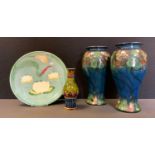 A pair of Danish Danico Studio pottery vases, decorated with stylised flowers, 24.5cm high; a