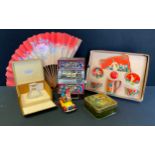 A Corgi Toys Noddy Car; High Roller money bank; Mazawattee Tea tin; Tin plate duet set, boxed; a