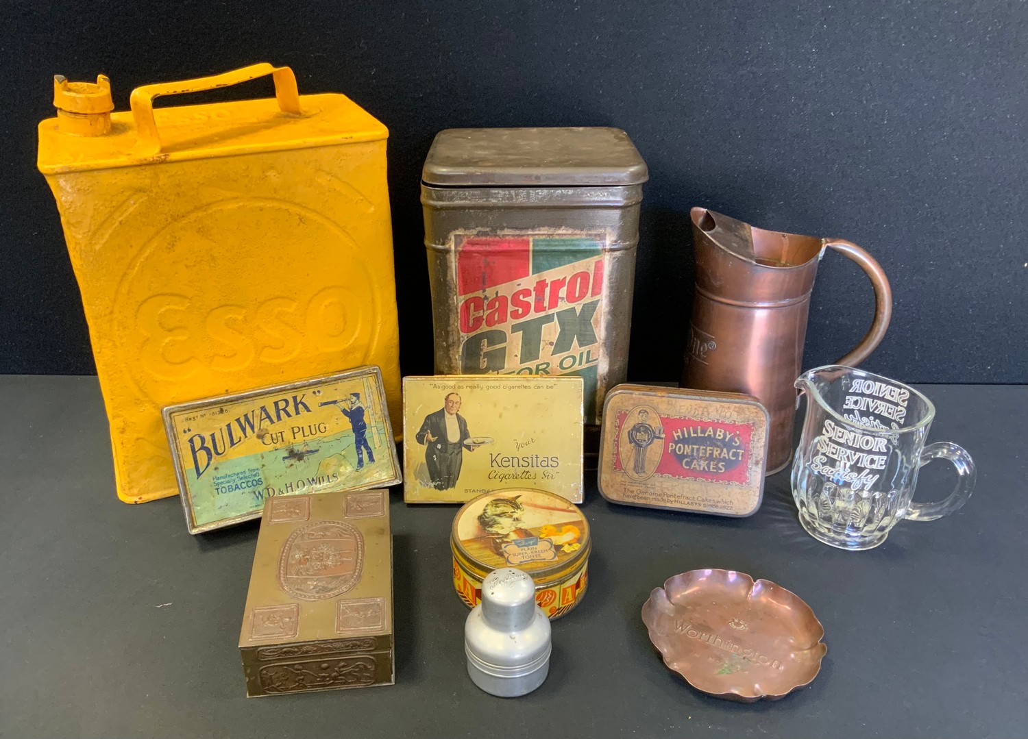 An Esso yellow petrol can; Bulwark Cut Plug tin; others, Ketel One Vodka jug etc.