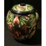 A Moorcroft 'Aphrodite' pattern lidded jar, tube lined decoration, designed by Shirley Hayes, 17cm